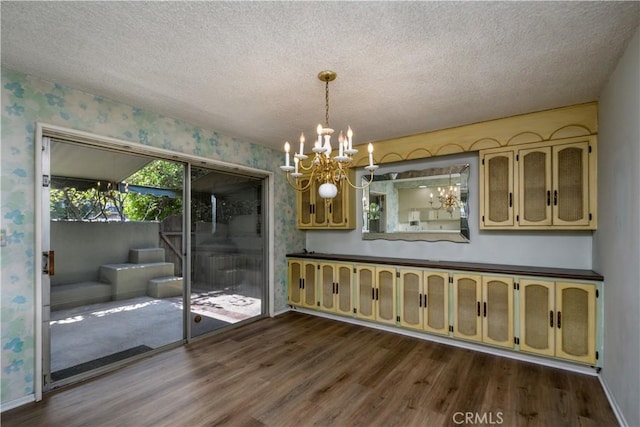 1032 S Golden W Ave Unit A, Arcadia, CA 91007 - unfurnished dining area featuring wallpapered walls, dark wood-type flooring, a chandelier, and a textured ceiling