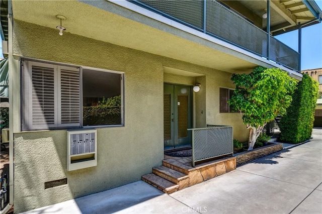 1032 S Golden W Ave Unit A, Arcadia, CA 91007 - view of exterior entry featuring stucco siding, french doors, and a patio