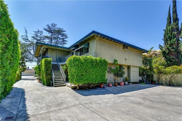 1032 S Golden W Ave Unit A, Arcadia, CA 91007 - view of side of property with stairs and stucco siding