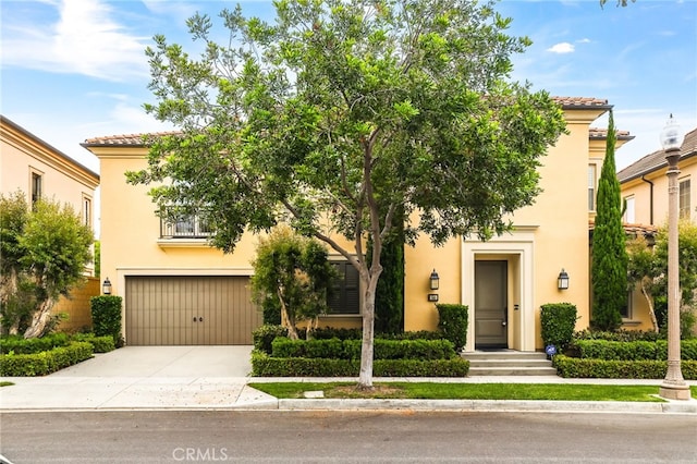 54 Sycamore Bnd, Irvine, CA 92620 - view of front of home featuring stucco siding, an attached garage, driveway, and a tiled roof