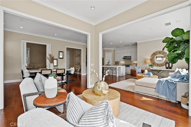54 Sycamore Bnd, Irvine, CA 92620 - living room with dark wood-type flooring, ornamental molding, and recessed lighting