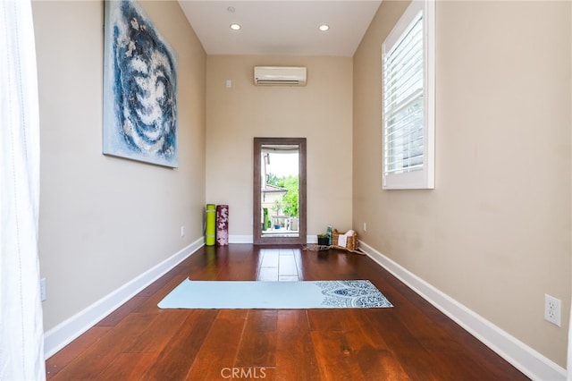 54 Sycamore Bnd, Irvine, CA 92620 - doorway to outside featuring a wall mounted air conditioner, hardwood / wood-style floors, and recessed lighting