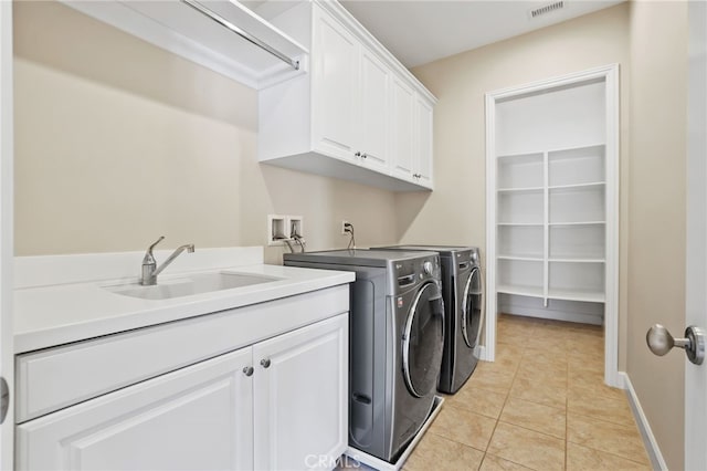 54 Sycamore Bnd, Irvine, CA 92620 - laundry room featuring cabinet space, washer and clothes dryer, and light tile patterned floors