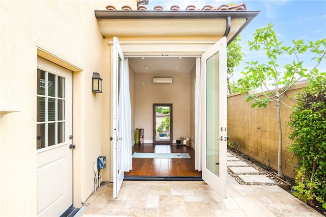 54 Sycamore Bnd, Irvine, CA 92620 - doorway to property with stucco siding and a wall mounted AC