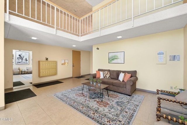 5300 E Atherton St Unit 2F, Long Beach, CA 90815 - living room featuring a towering ceiling, tile patterned floors, and recessed lighting