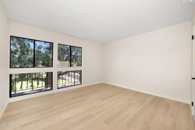 5300 E Atherton St Unit 2F, Long Beach, CA 90815 - spare room featuring light wood-style floors and cooling unit