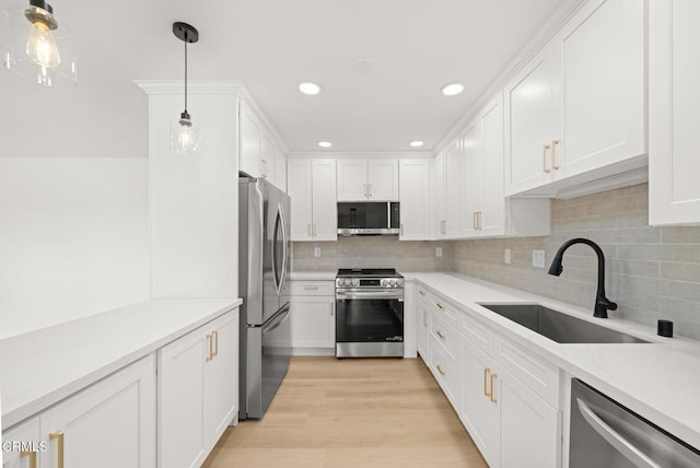 5300 E Atherton St Unit 2F, Long Beach, CA 90815 - kitchen featuring appliances with stainless steel finishes, white cabinets, light countertops, tasteful backsplash, and recessed lighting