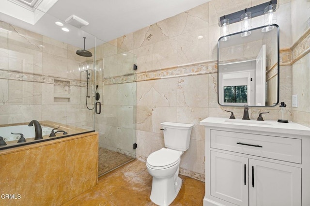 5300 E Atherton St Unit 2F, Long Beach, CA 90815 - full bathroom with tile walls, a shower stall, vanity, a jetted tub, and tile patterned flooring