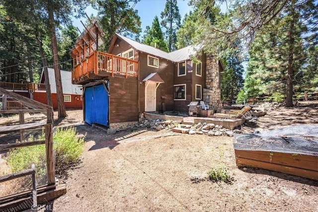25837 Sunset Loop, Twin Peaks, CA 92391 - back of property with a deck and a storage shed