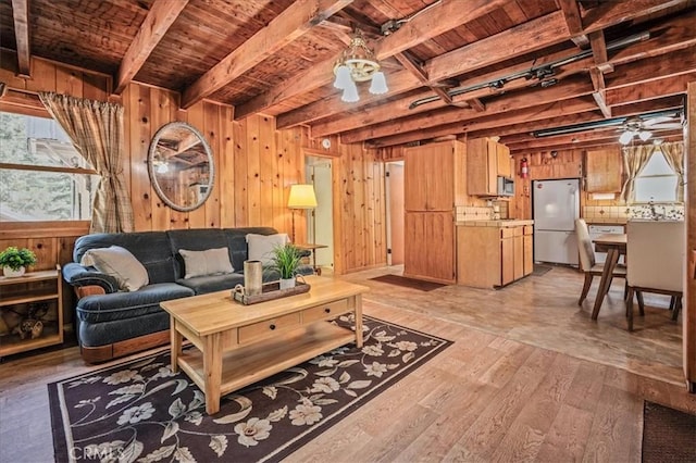 25837 Sunset Loop, Twin Peaks, CA 92391 - living area with a wood ceiling with exposed beams, light wood-style floors, healthy amount of natural light, wood walls, and a ceiling fan