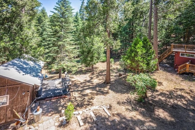 25837 Sunset Loop, Twin Peaks, CA 92391 - view of yard featuring stairway, a deck, and a forest view