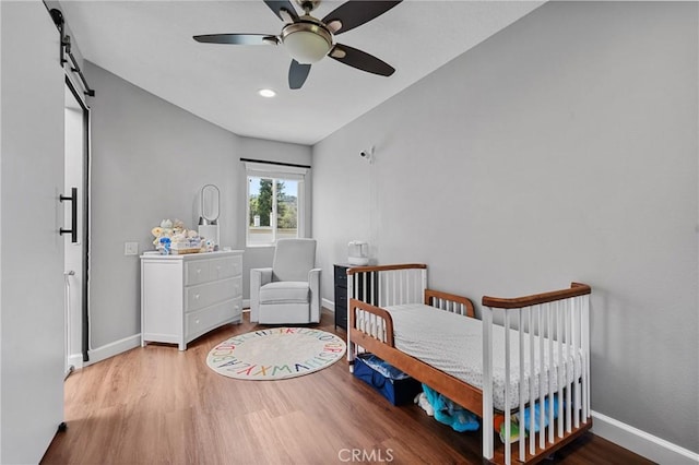 222 N Singingwood St Unit 9, Orange, CA 92869 - bedroom featuring wood finished floors, a ceiling fan, and recessed lighting