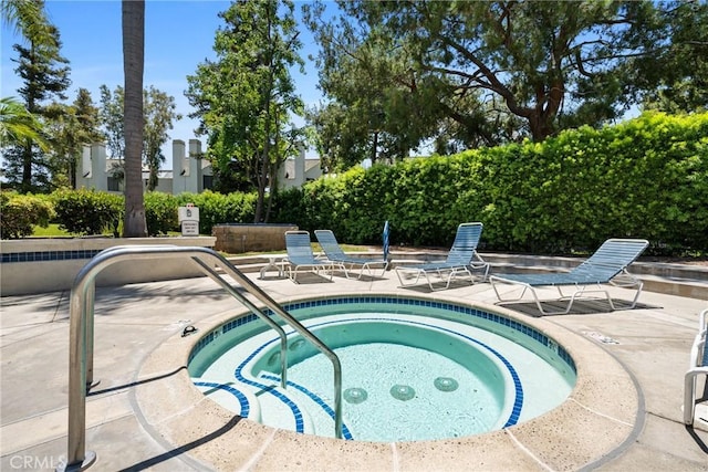 222 N Singingwood St Unit 9, Orange, CA 92869 - view of swimming pool featuring a patio area and a community hot tub