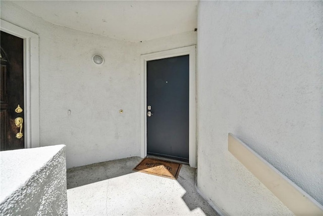 222 N Singingwood St Unit 9, Orange, CA 92869 - doorway to property with stucco siding