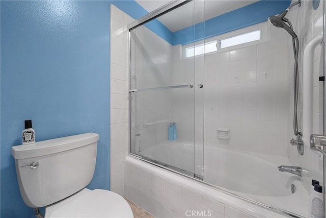 222 N Singingwood St Unit 9, Orange, CA 92869 - bathroom with bath / shower combo with glass door and toilet