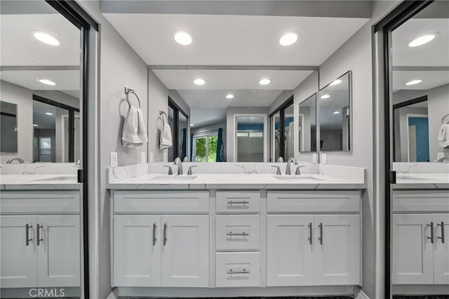 222 N Singingwood St Unit 9, Orange, CA 92869 - full bathroom with two vanities and recessed lighting
