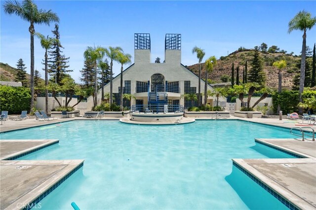 222 N Singingwood St Unit 9, Orange, CA 92869 - community pool featuring a patio area and a mountain view
