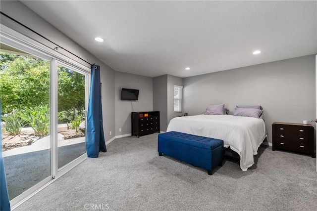 222 N Singingwood St Unit 9, Orange, CA 92869 - bedroom with multiple windows, carpet flooring, recessed lighting, and access to outside