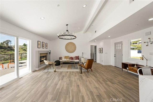 235 Via Ballena, San Clemente, CA 92672 - living room with a chandelier, recessed lighting, a glass covered fireplace, and light wood finished floors