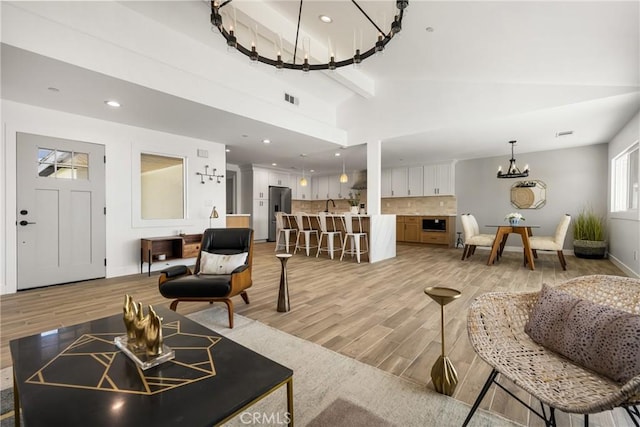 235 Via Ballena, San Clemente, CA 92672 - living room with a chandelier, light wood-style floors, recessed lighting, and lofted ceiling