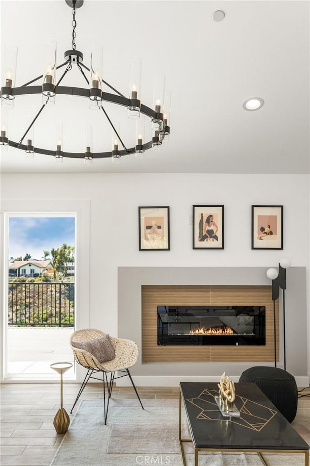 235 Via Ballena, San Clemente, CA 92672 - living room featuring a glass covered fireplace, recessed lighting, wood finished floors, and a chandelier
