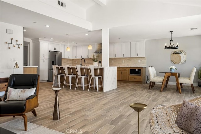235 Via Ballena, San Clemente, CA 92672 - living area featuring light wood finished floors, a chandelier, and recessed lighting