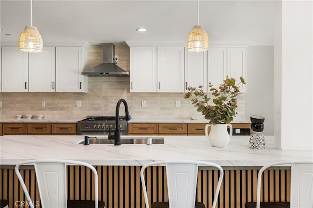 235 Via Ballena, San Clemente, CA 92672 - kitchen featuring wall chimney range hood, decorative light fixtures, decorative backsplash, and recessed lighting