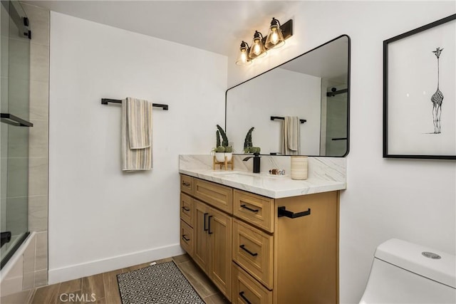 235 Via Ballena, San Clemente, CA 92672 - bathroom featuring vanity, wood finished floors, and shower / bath combination with glass door