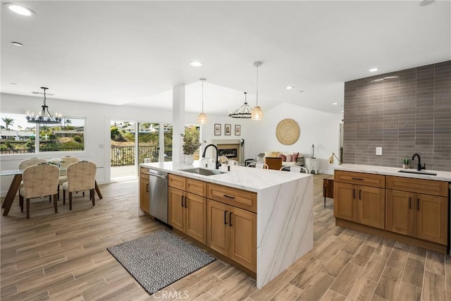 235 Via Ballena, San Clemente, CA 92672 - kitchen with stainless steel dishwasher, a fireplace, light wood-style flooring, decorative light fixtures, and recessed lighting