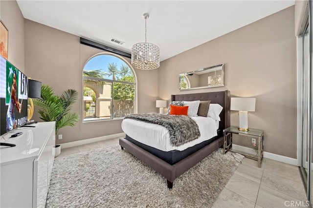 56720 Jack Nicklaus Blvd, La Quinta, CA 92253 - bedroom with a chandelier and baseboards