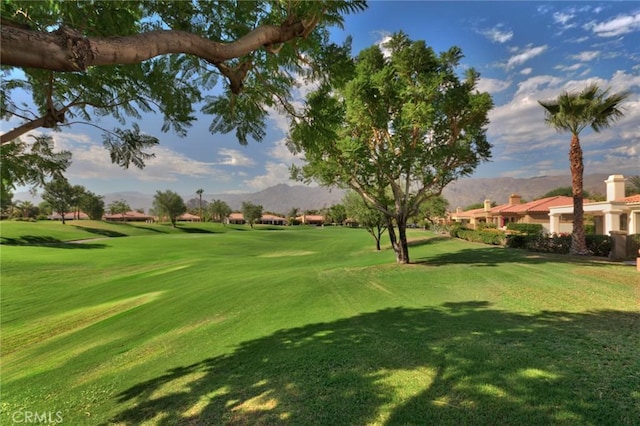 56720 Jack Nicklaus Blvd, La Quinta, CA 92253 - view of home's community featuring a mountain view, golf course view, and a yard