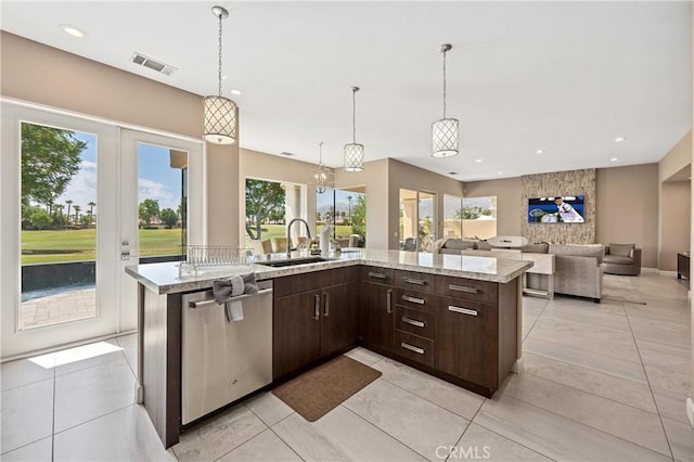 56720 Jack Nicklaus Blvd, La Quinta, CA 92253 - kitchen featuring dishwasher, dark brown cabinets, light stone counters, open floor plan, and recessed lighting
