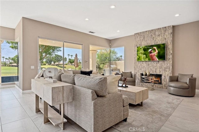 56720 Jack Nicklaus Blvd, La Quinta, CA 92253 - living room with a large fireplace, recessed lighting, and light tile patterned flooring