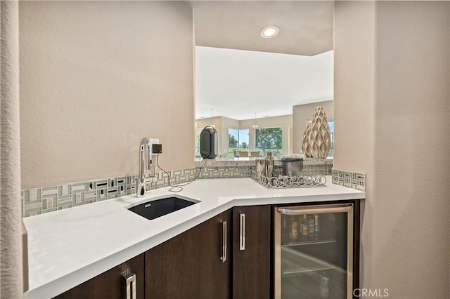 56720 Jack Nicklaus Blvd, La Quinta, CA 92253 - bar featuring wine cooler and tasteful backsplash