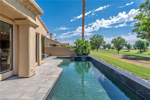 56720 Jack Nicklaus Blvd, La Quinta, CA 92253 - view of swimming pool featuring a lawn and a patio