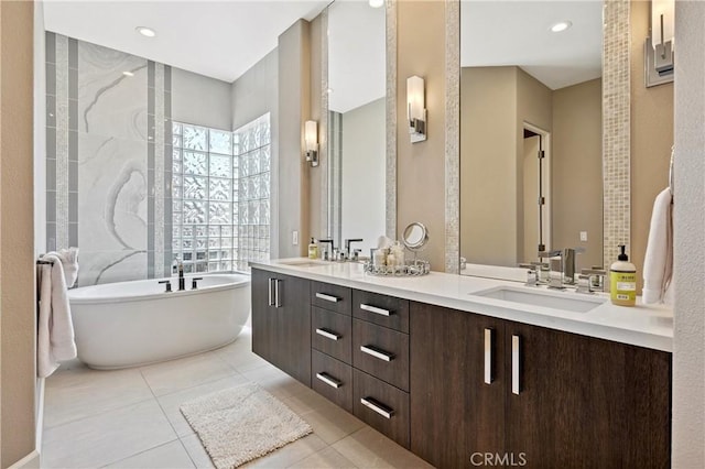 56720 Jack Nicklaus Blvd, La Quinta, CA 92253 - bathroom featuring a soaking tub, double vanity, and tile patterned flooring