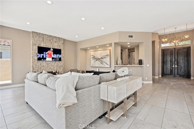 56720 Jack Nicklaus Blvd, La Quinta, CA 92253 - living area featuring a chandelier, recessed lighting, and light marble finish floors