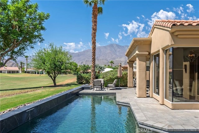 56720 Jack Nicklaus Blvd, La Quinta, CA 92253 - swimming pool with a mountain view, a patio, and a lawn