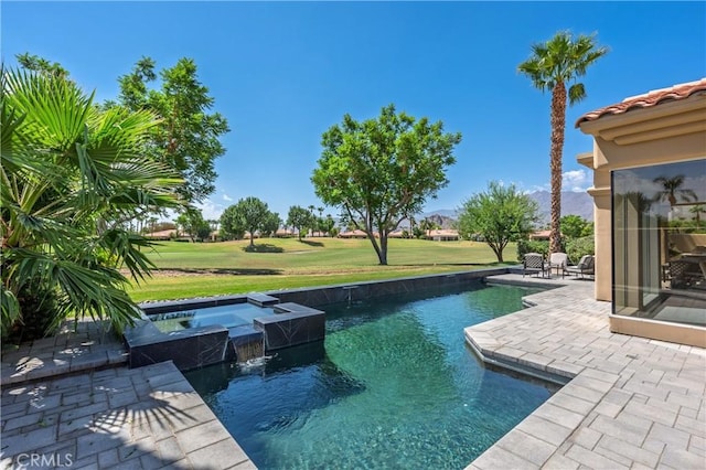56720 Jack Nicklaus Blvd, La Quinta, CA 92253 - view of pool featuring a patio area, a lawn, and a pool with connected hot tub