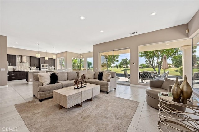 56720 Jack Nicklaus Blvd, La Quinta, CA 92253 - living room featuring healthy amount of natural light, recessed lighting, and light tile patterned floors