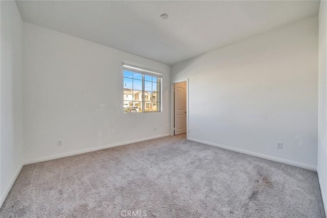 29601 Tulipwood St, Menifee, CA 92584 - carpeted empty room featuring baseboards