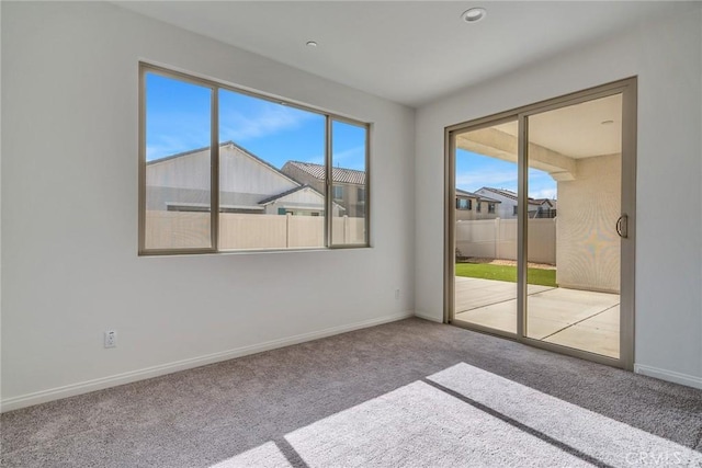 29601 Tulipwood St, Menifee, CA 92584 - carpeted empty room featuring plenty of natural light