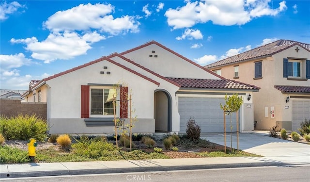 29601 Tulipwood St, Menifee, CA 92584 - mediterranean / spanish home featuring a tiled roof, stucco siding, an attached garage, and concrete driveway