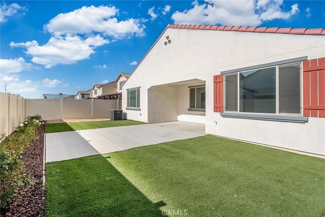 29601 Tulipwood St, Menifee, CA 92584 - rear view of property with a fenced backyard, stucco siding, and a patio