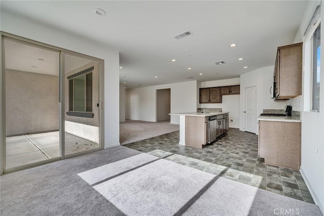 29601 Tulipwood St, Menifee, CA 92584 - kitchen featuring open floor plan, light carpet, a center island with sink, stove, and recessed lighting