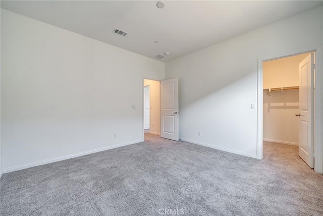 29601 Tulipwood St, Menifee, CA 92584 - unfurnished bedroom with carpet floors, a walk in closet, and a closet