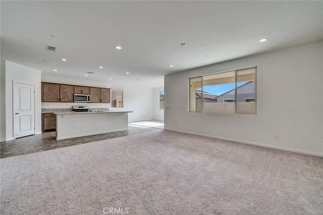 29601 Tulipwood St, Menifee, CA 92584 - unfurnished living room with recessed lighting and carpet flooring