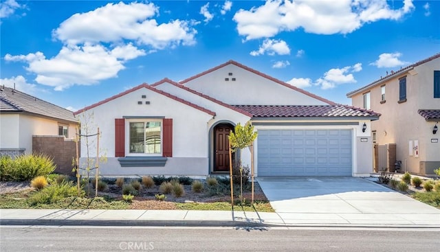 29601 Tulipwood St, Menifee, CA 92584 - mediterranean / spanish home featuring a tile roof, stucco siding, an attached garage, and concrete driveway