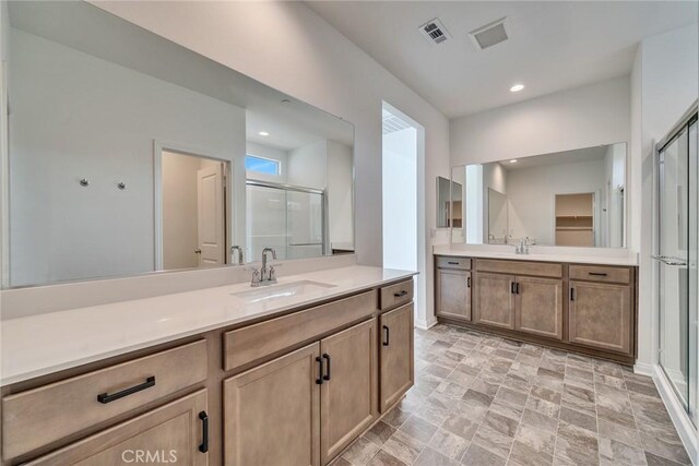 29601 Tulipwood St, Menifee, CA 92584 - full bath with a shower stall, vanity, stone finish flooring, a closet, and recessed lighting