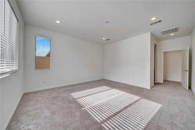 29601 Tulipwood St, Menifee, CA 92584 - empty room with light carpet and recessed lighting